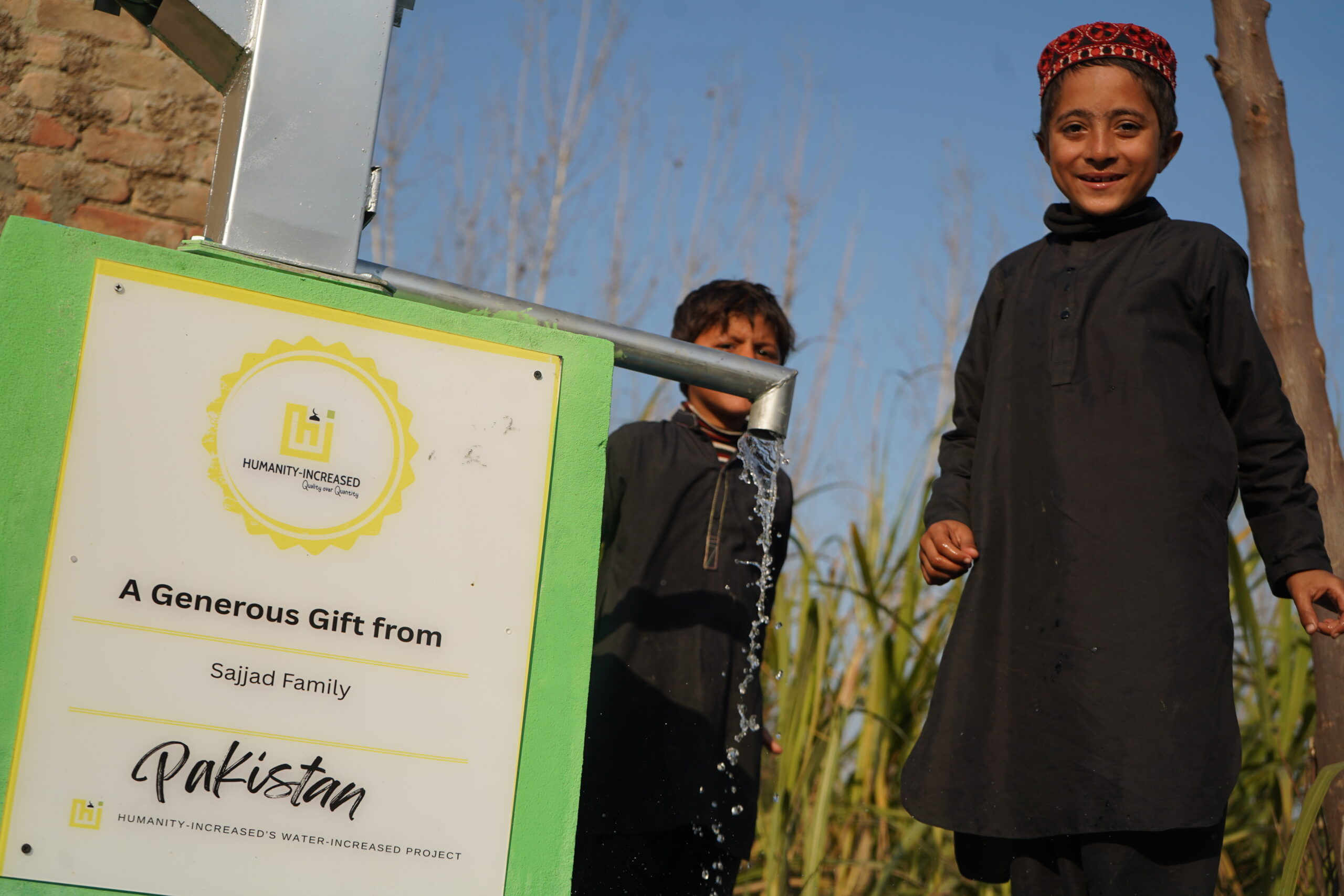 Boy in Pakistan with Water wells