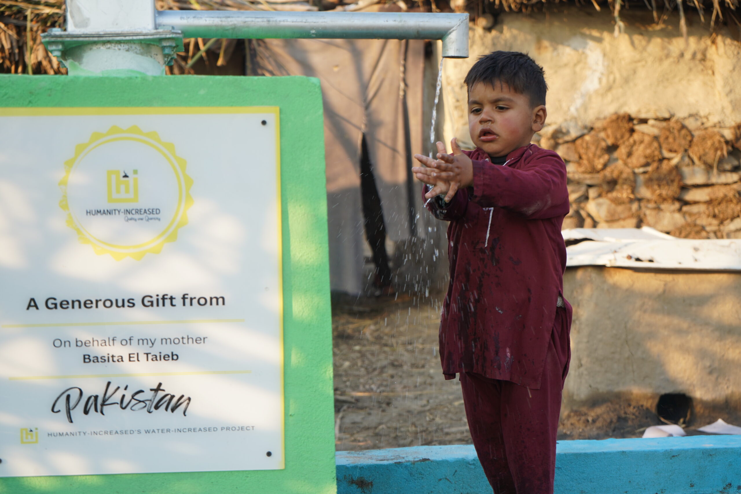 Boy in Pakistan with Water wells